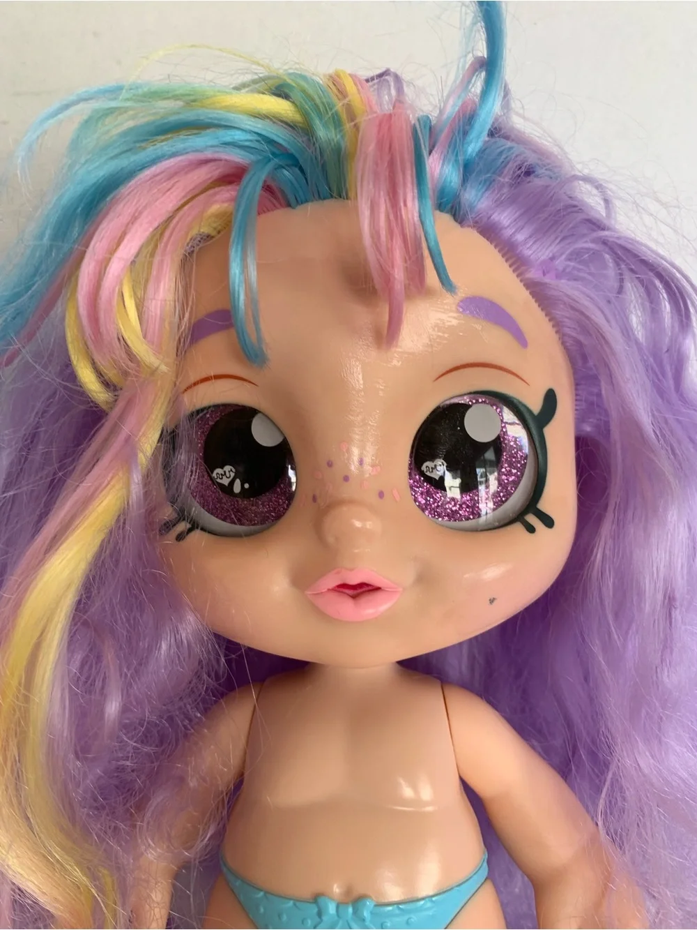 Kindi Kids Rainbow Kate doll with pastel hair and large glitter eye